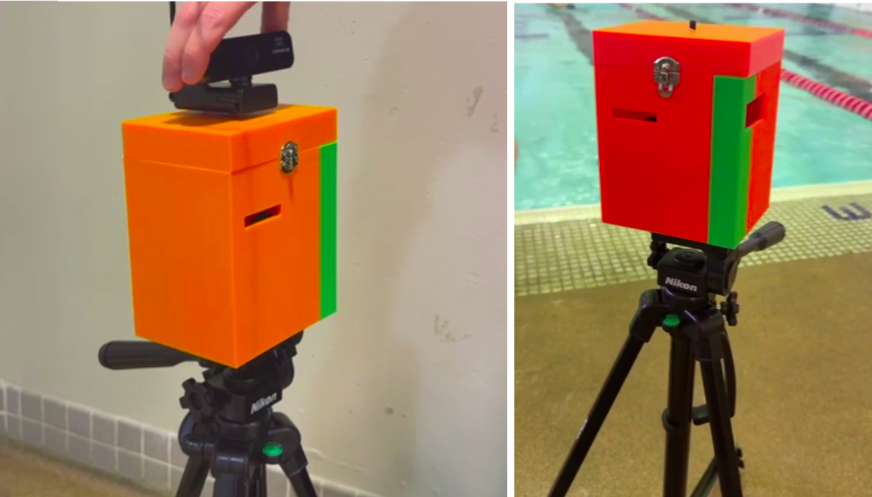 Orange 3D printed box attached to tripod stand